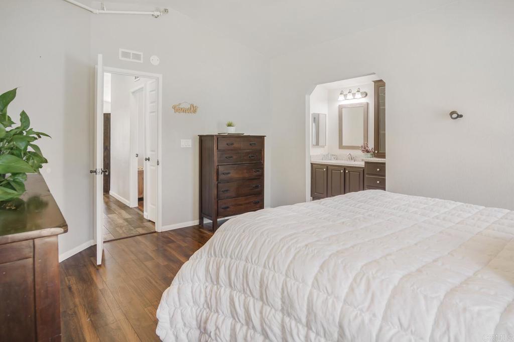 3465 Barrett View Road Alpine, CA 91901 - Photo 12 of 36 a bedroom with a bed and wooden floor