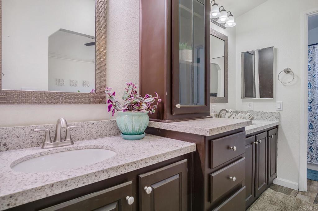 3465 Barrett View Road Alpine, CA 91901 - Photo 13 of 36 a bathroom with a granite countertop sink and a mirror