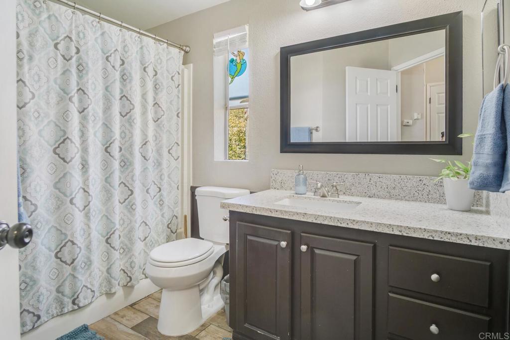 3465 Barrett View Road Alpine, CA 91901 - Photo 15 of 36 a bathroom with a granite countertop sink and a toilet