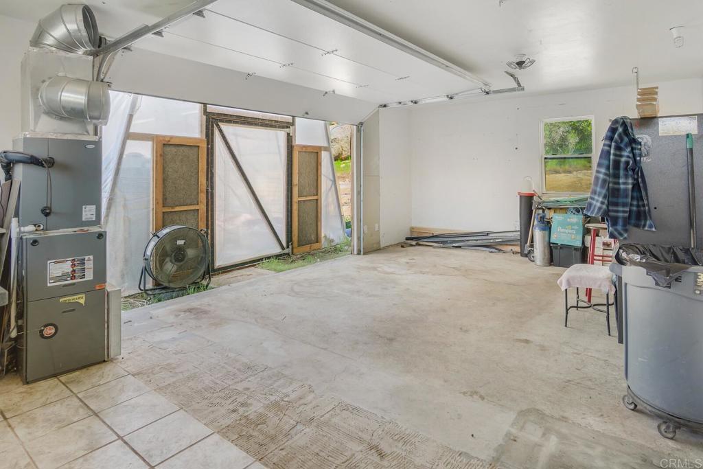 3465 Barrett View Road Alpine, CA 91901 - Photo 21 of 36 a view of a livingroom with furniture and a flat screen tv