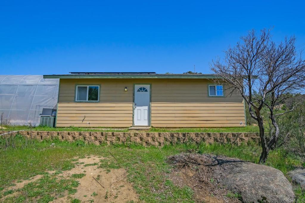 3465 Barrett View Road Alpine, CA 91901 - Photo 29 of 36 a side view of a house with a yard