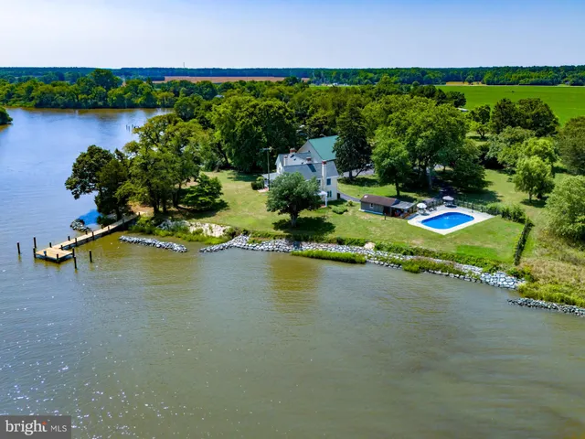 an aerial view of a house with outdoor space swimming pool and outdoor space