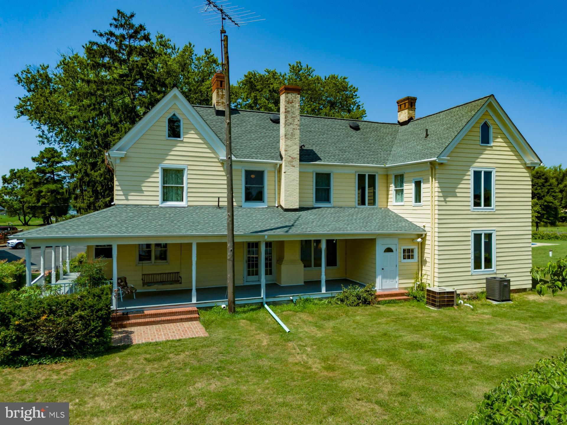2208 Horns Point Road Cambridge, MD 21613 - Photo 12 of 61 a front view of a house with a yard