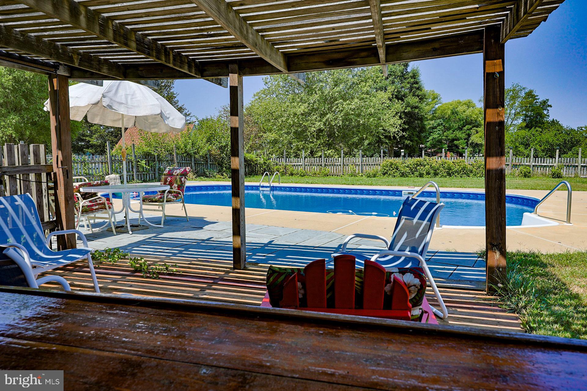 2208 Horns Point Road Cambridge, MD 21613 - Photo 15 of 61 a view of a chairs and table in the patio