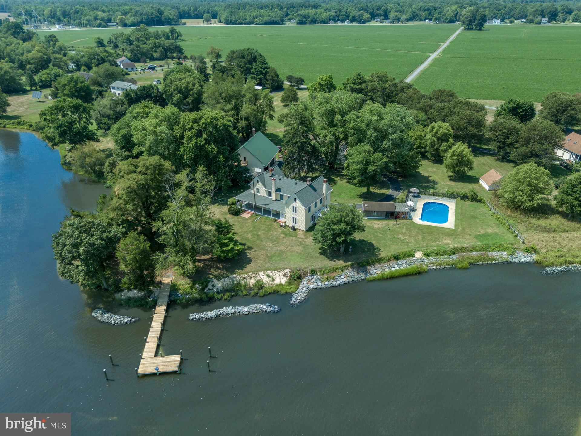 2208 Horns Point Road Cambridge, MD 21613 - Photo 2 of 61 an aerial view of a house with a yard basket ball court and outdoor seating
