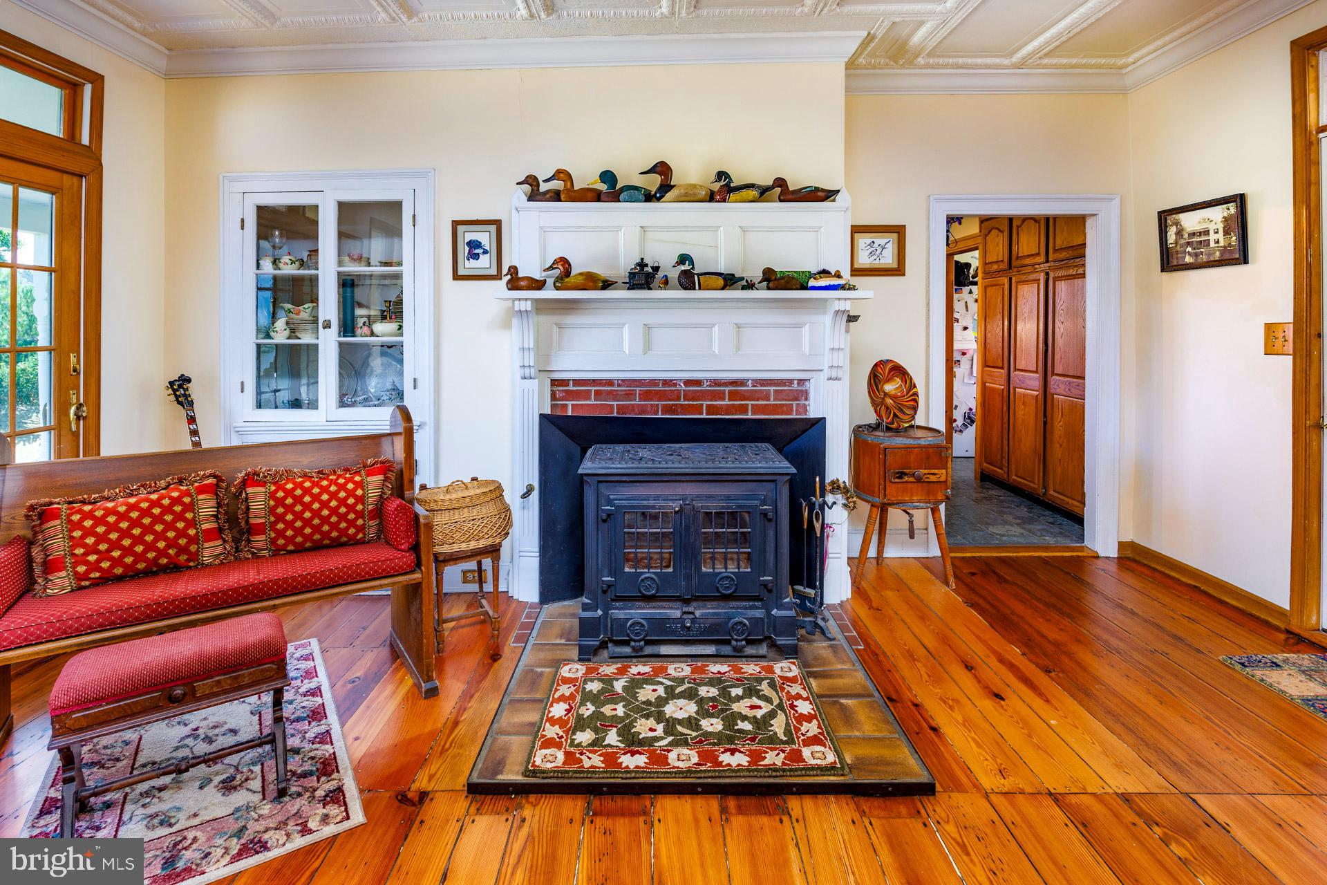2208 Horns Point Road Cambridge, MD 21613 - Photo 30 of 61 a living room with furniture and a fireplace