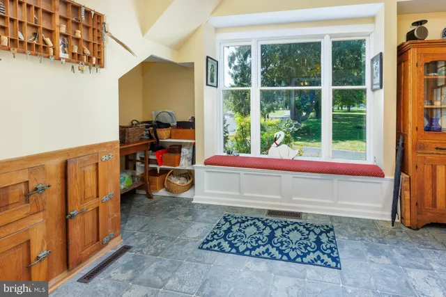 a bedroom with a bed and wooden cabinets