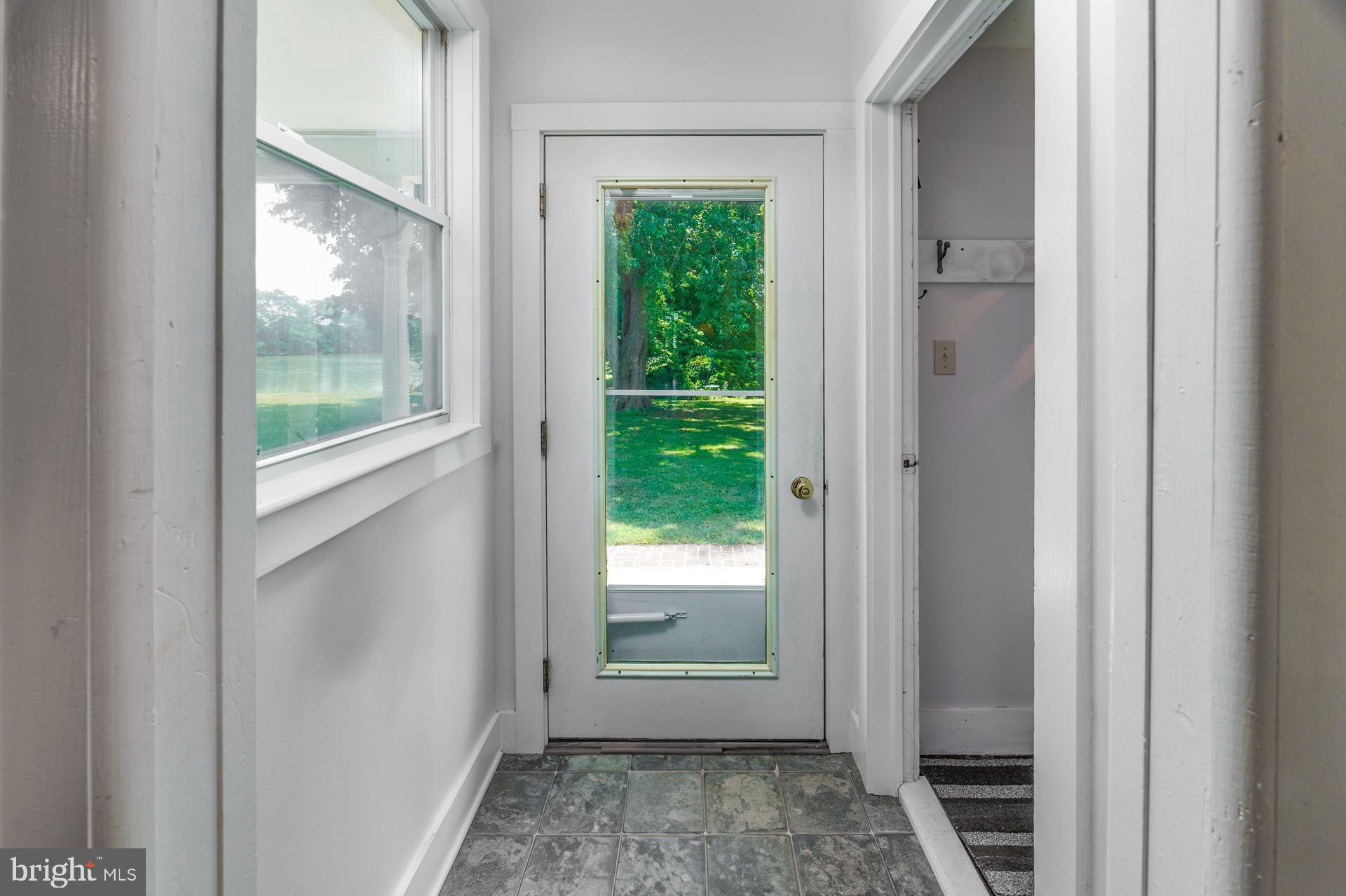 2208 Horns Point Road Cambridge, MD 21613 - Photo 34 of 61 a view of a glass door with a yard