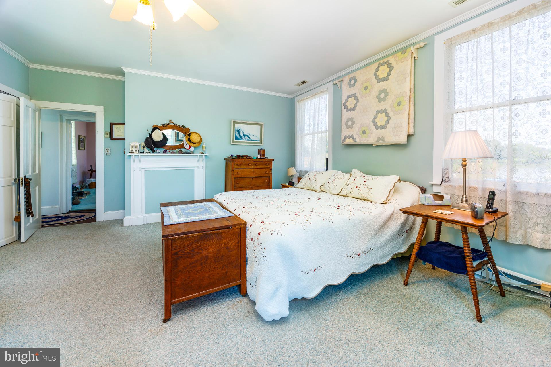 2208 Horns Point Road Cambridge, MD 21613 - Photo 39 of 61 a bed room with a bed and a table