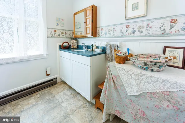a living room with a fireplace furniture and a window