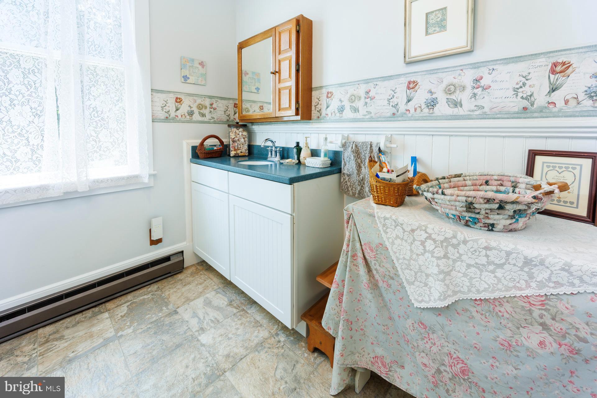 2208 Horns Point Road Cambridge, MD 21613 - Photo 41 of 61 a room with cabinets and window