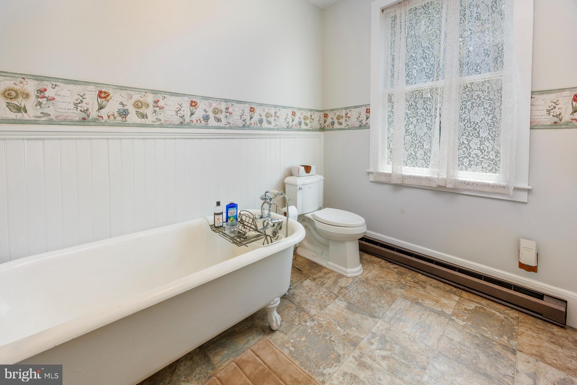 2208 Horns Point Road Cambridge, MD 21613 - Photo 42 of 61 a bathroom with a sink a toilet and a bathtub