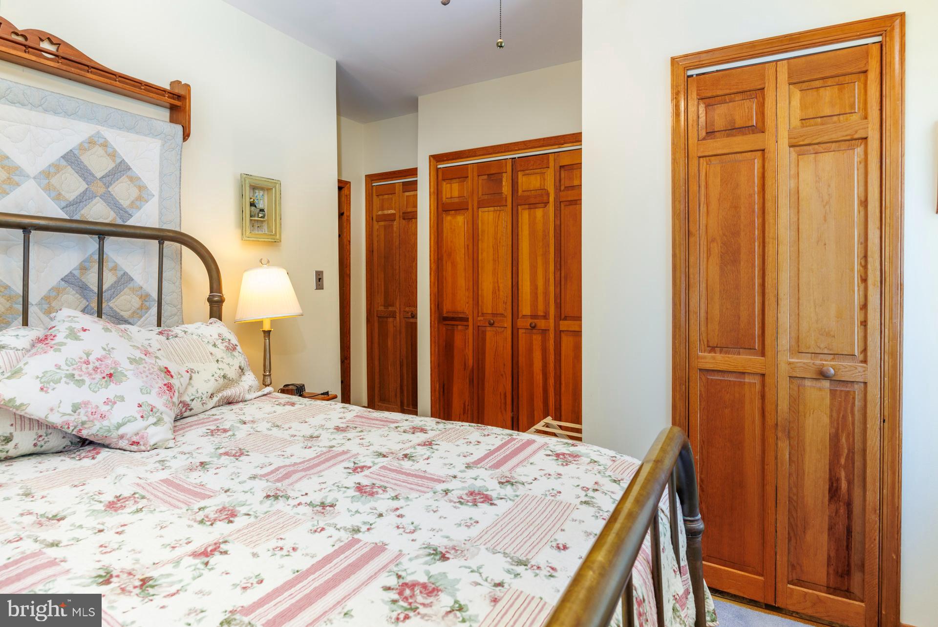 2208 Horns Point Road Cambridge, MD 21613 - Photo 45 of 61 a bedroom with a bed and a dresser