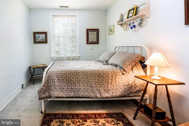 a front view of the house with outdoor seating