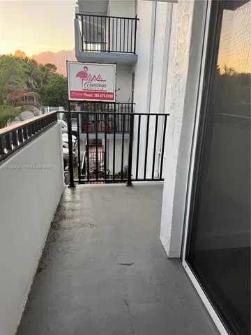 a view of balcony with furniture