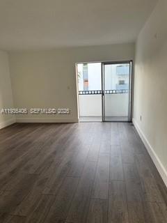 2460 Southwest 18th Avenue, Unit 1211 Miami, FL 33133 - Photo 3 of 15 a view of a livingroom with wooden floor
