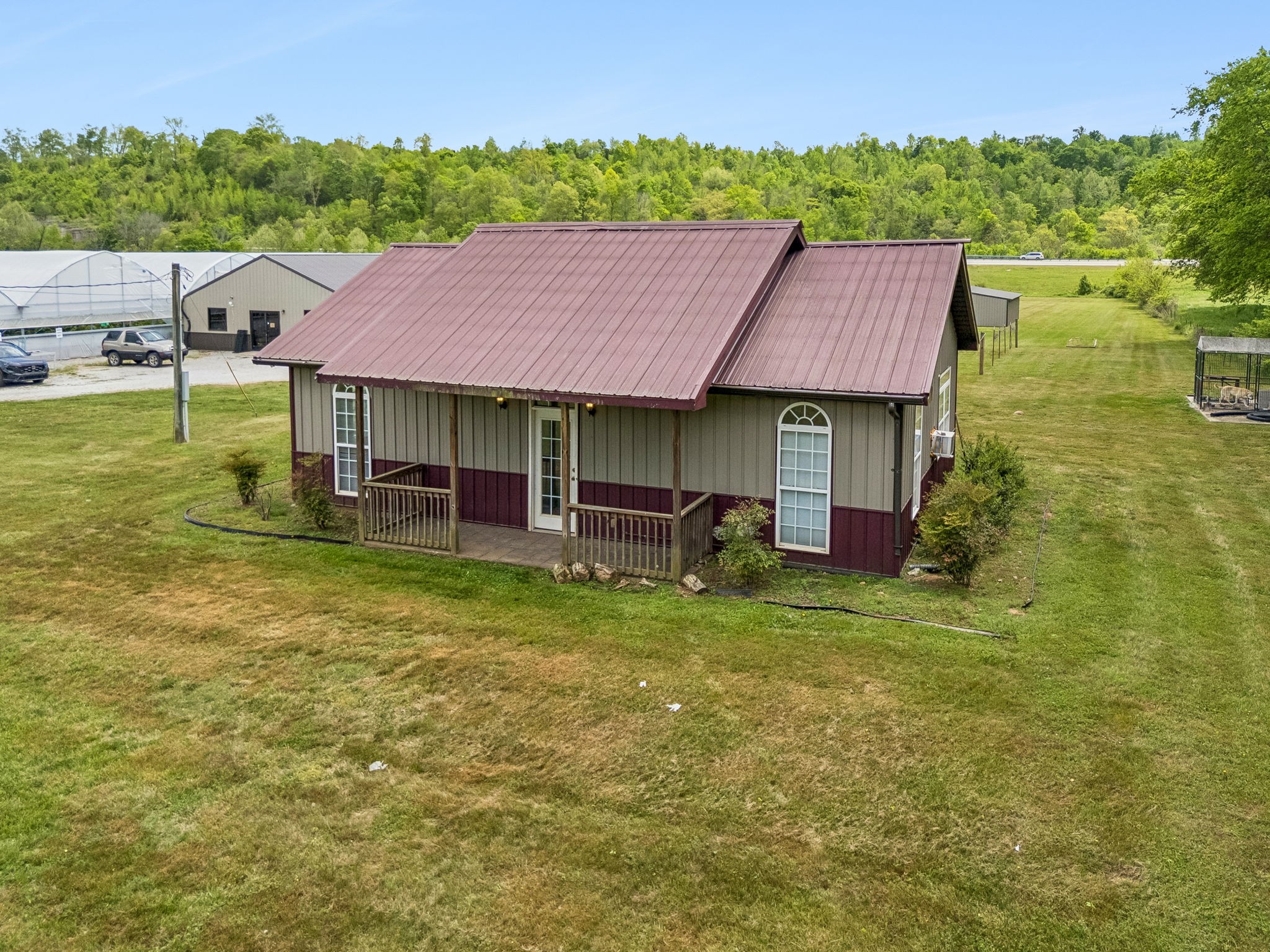 2461 Bodenham Road Pulaski, TN 38478 - Photo 79 of 100 a backyard of a house with table and chairs