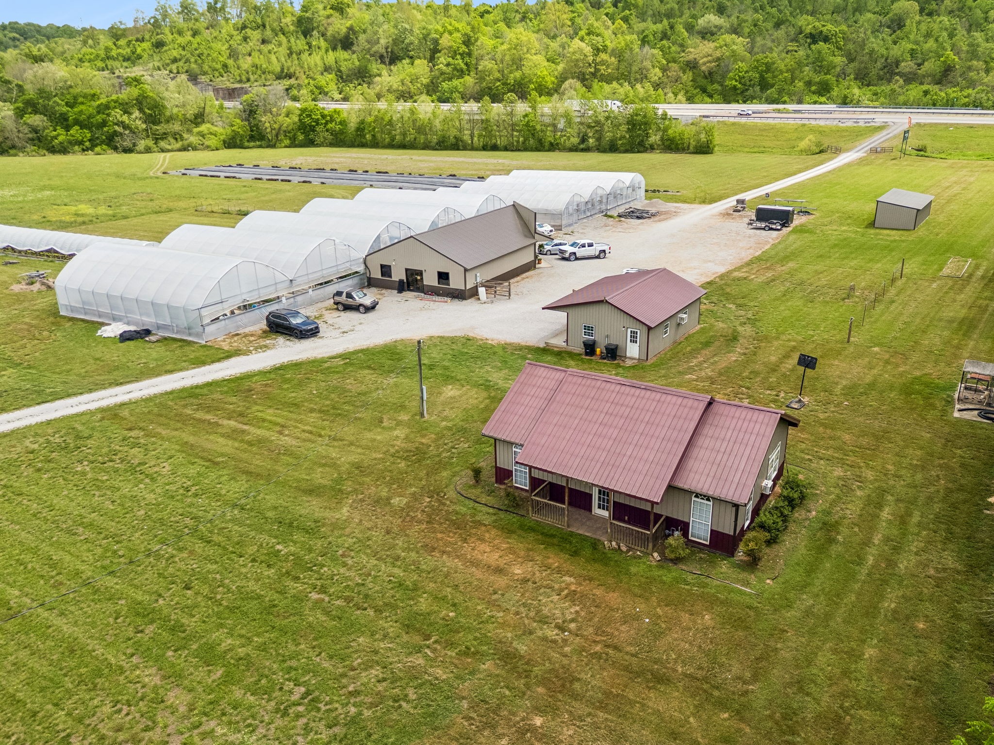 2461 Bodenham Road Pulaski, TN 38478 - Photo 80 of 100 a view of a lake with a yard and a swimming pool