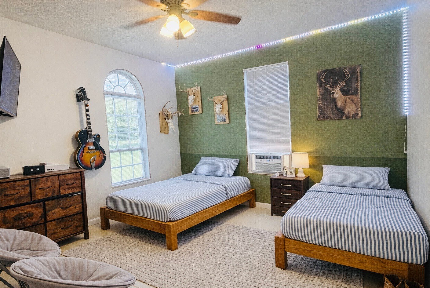 2461 Bodenham Road Pulaski, TN 38478 - Photo 82 of 100 a bedroom with 2 bed and a chandelier