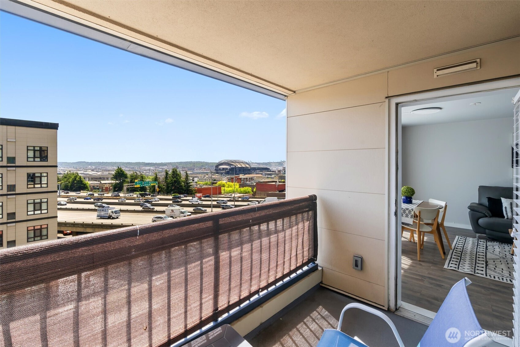 a view of a living room and a balcony