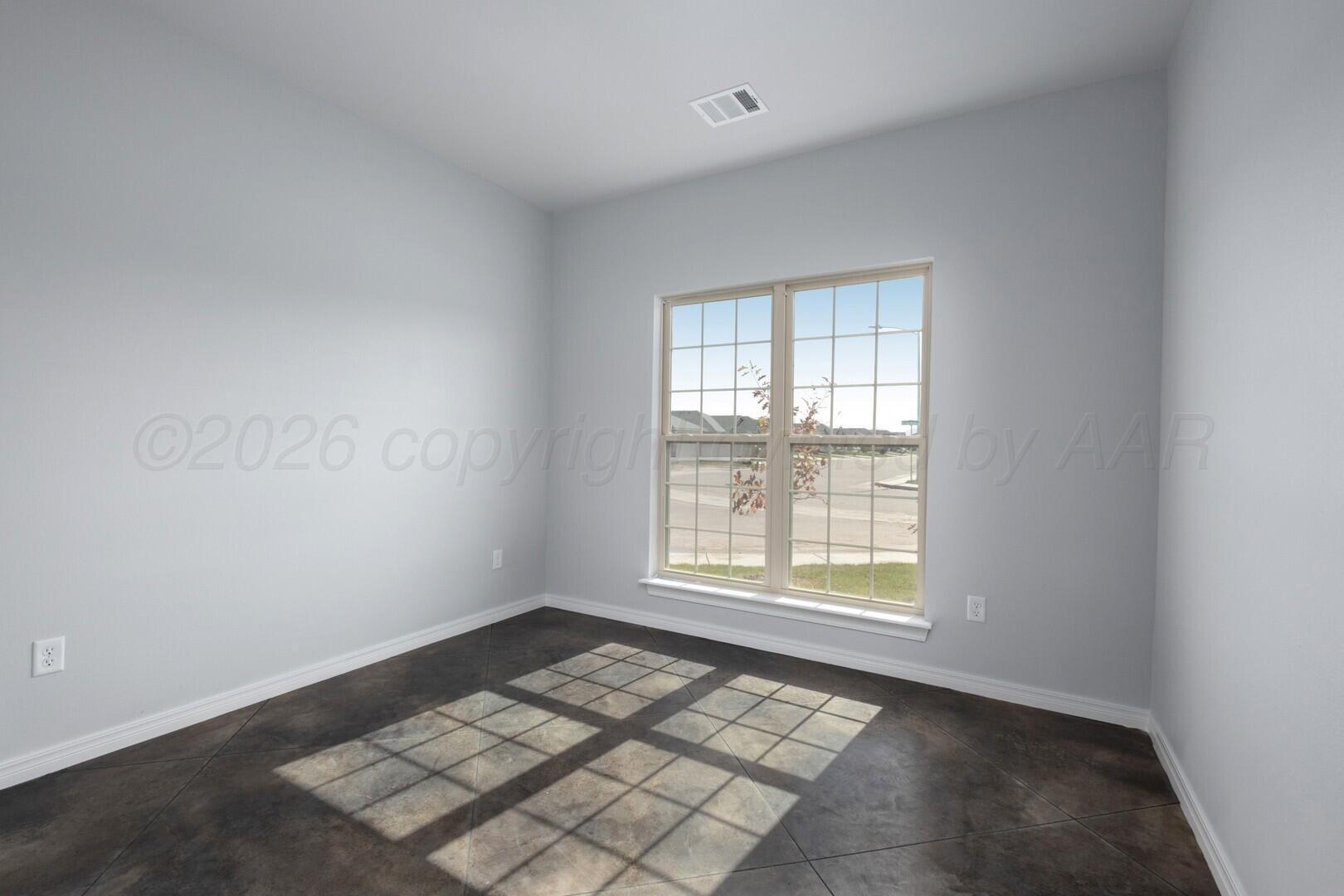 10311 Ruse Street Amarillo, TX 79118 - Photo 17 of 29 an empty room with windows