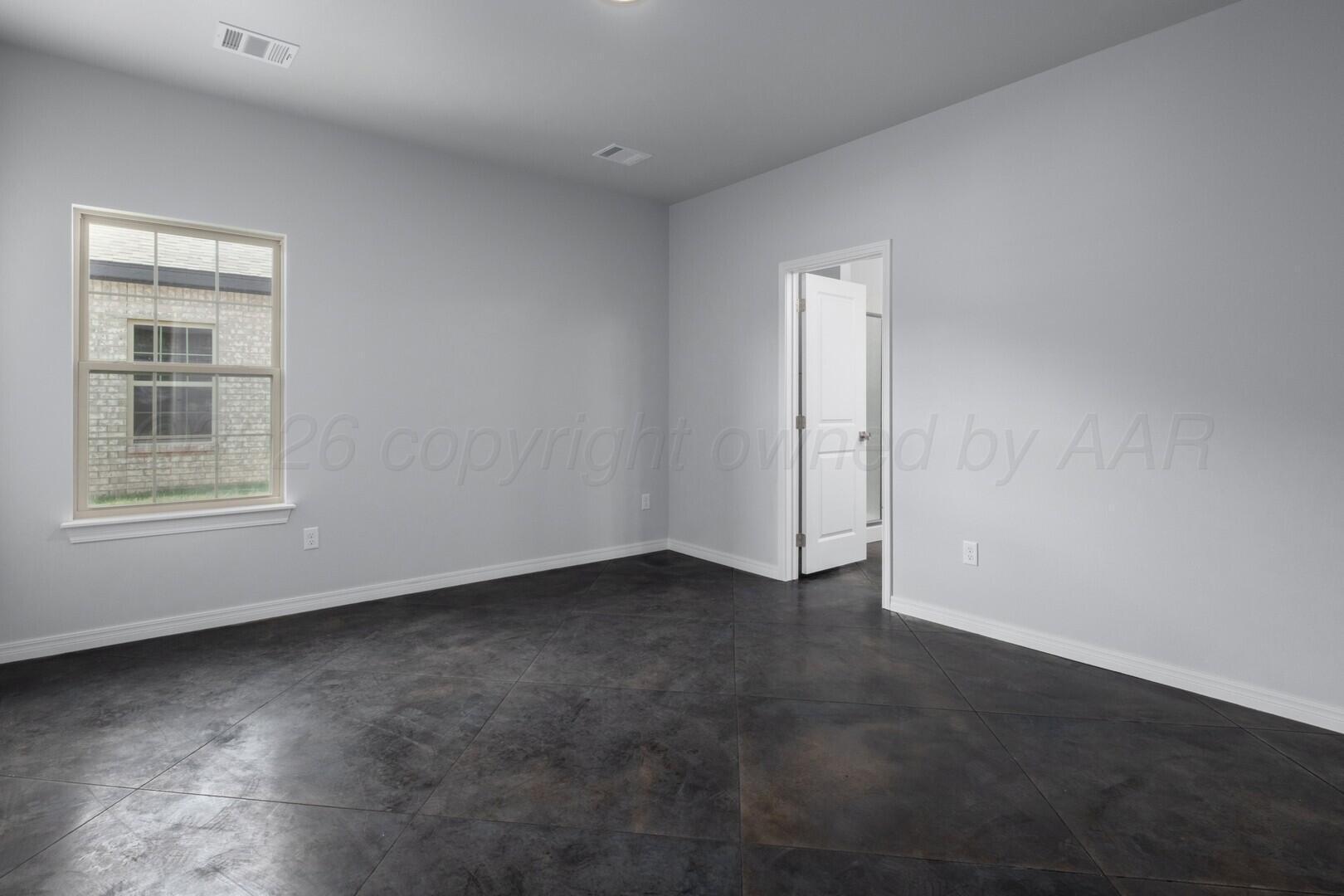 10311 Ruse Street Amarillo, TX 79118 - Photo 10 of 29 an empty room with windows