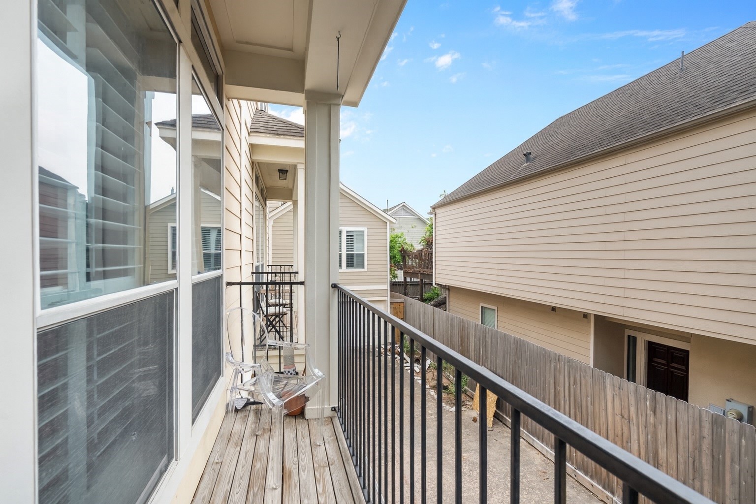 5239 Schuler Street, Unit C Houston, TX 77007 - Photo 16 of 16 a view of a balcony with wooden floor and fence
