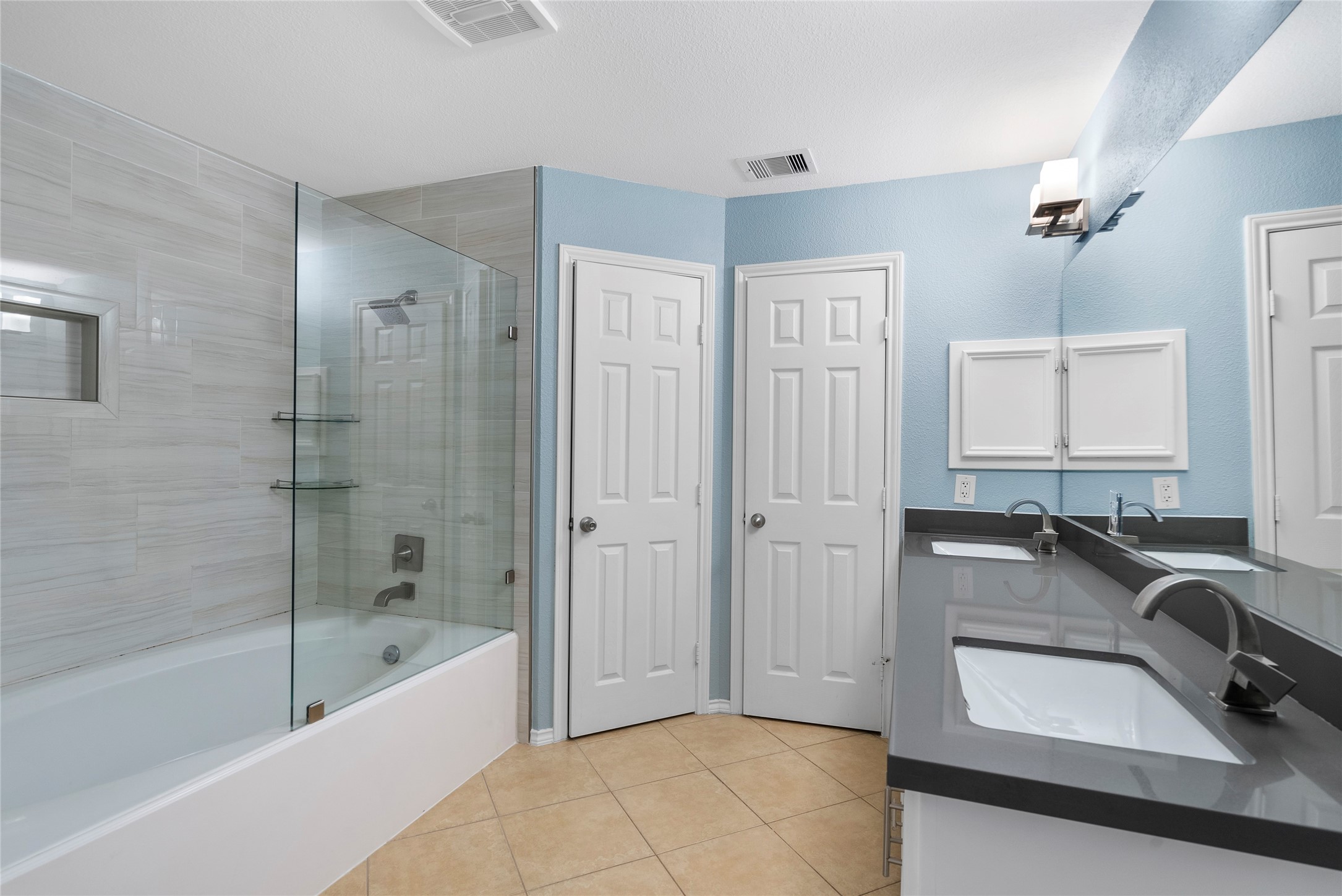 5239 Schuler Street, Unit C Houston, TX 77007 - Photo 10 of 16 a bathroom with a tub sink and mirror