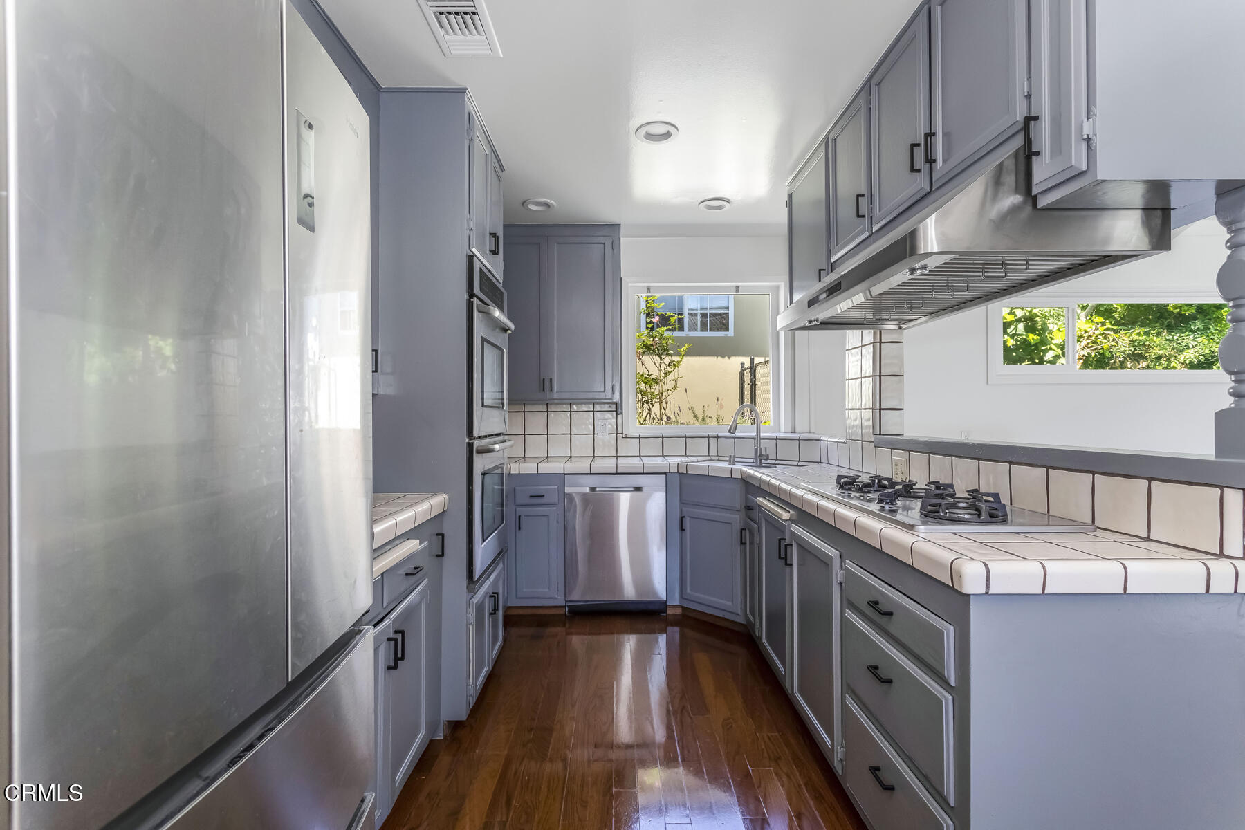 1338 Brixton Road Pasadena, CA 91105 - Photo 12 of 43 a kitchen with stainless steel appliances a sink and a stove