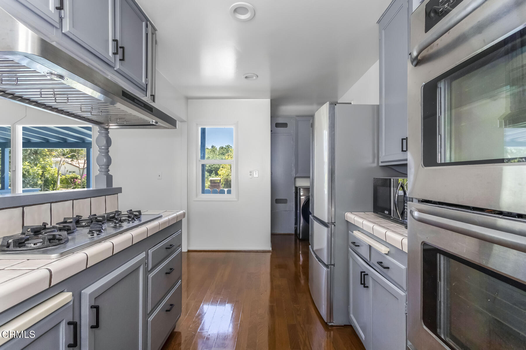 1338 Brixton Road Pasadena, CA 91105 - Photo 14 of 43 a kitchen with stainless steel appliances granite countertop a sink stove and refrigerator