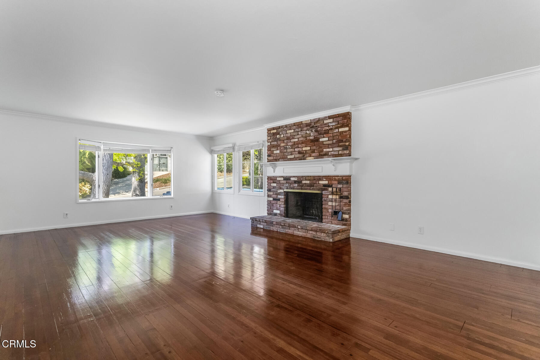 1338 Brixton Road Pasadena, CA 91105 - Photo 5 of 43 a living room with furniture wooden floor and a fireplace