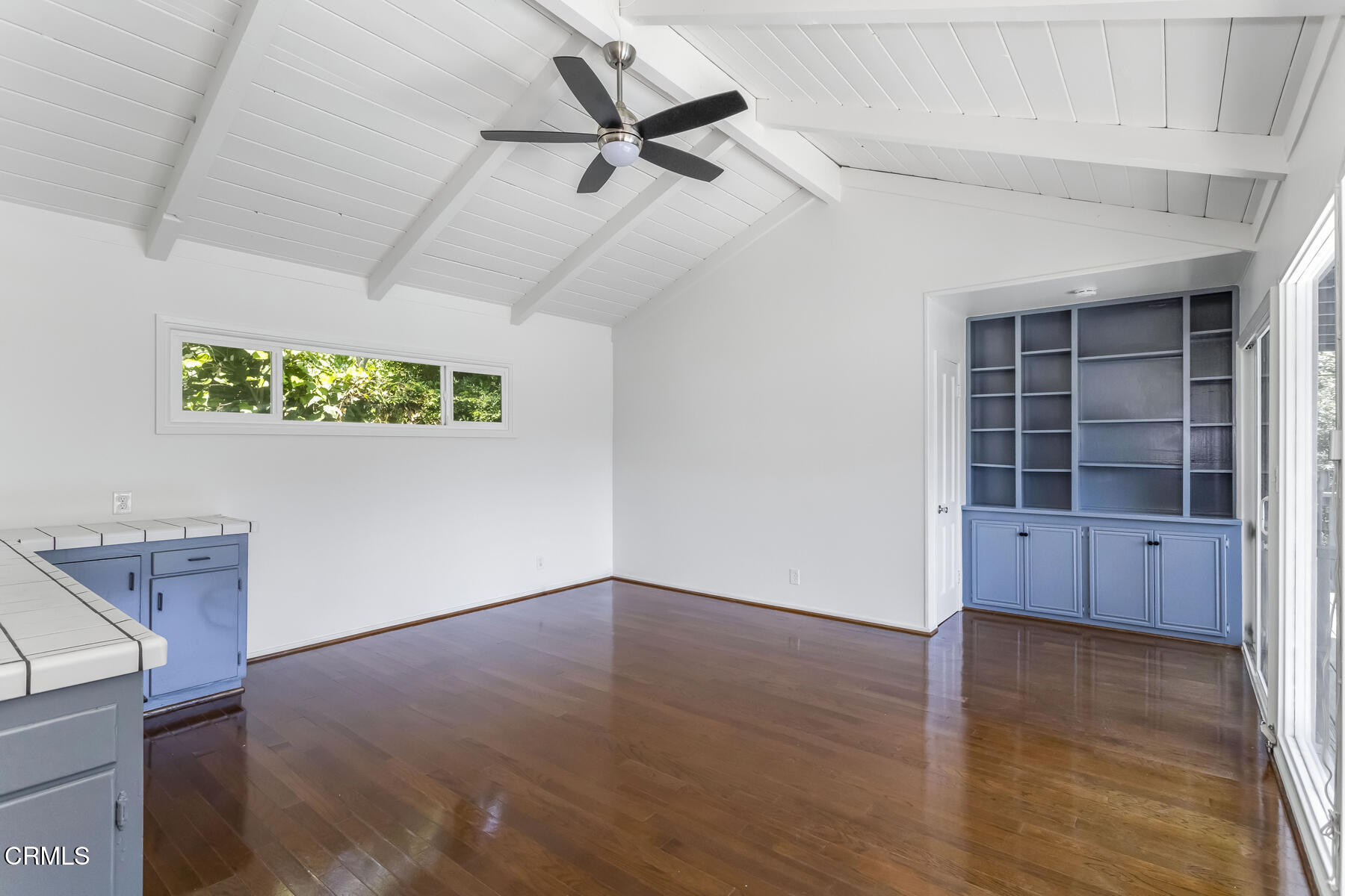 1338 Brixton Road Pasadena, CA 91105 - Photo 7 of 43 an empty room with windows and ceiling fan