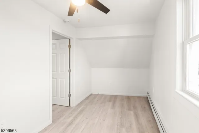 an empty room with a empty space and a window