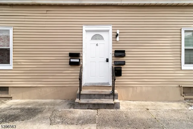 a view of a door of a house with a door and a yard