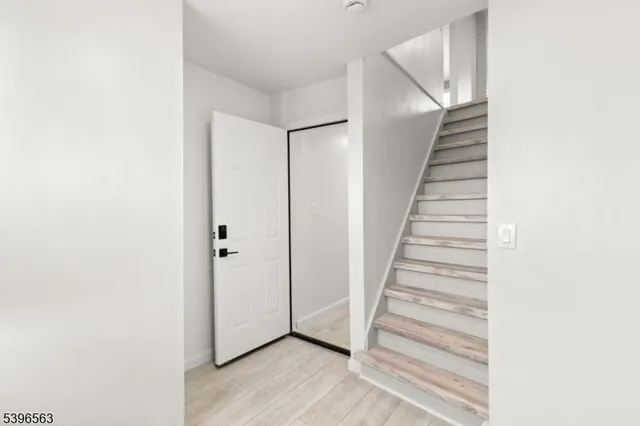 a view of a hallway with staircase