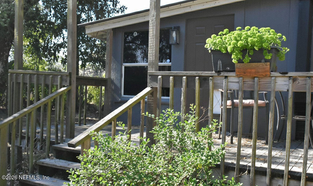 109 Lake Ida Point Drive Interlachen, FL 32148 - Photo 13 of 20 ExteriorFrontPorchaddedGreeneryitems