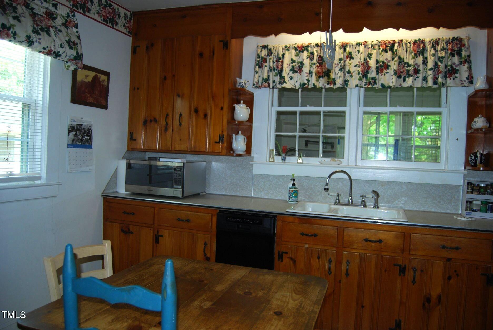 1013 Green Street Durham, NC 27701 - Photo 11 of 32 a kitchen with a sink and a window