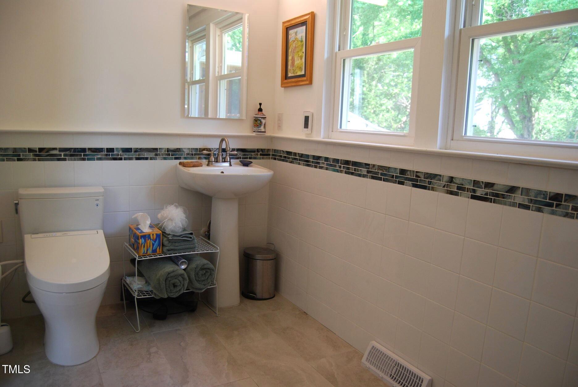 1013 Green Street Durham, NC 27701 - Photo 18 of 32 a bathroom with a sink and a toilet