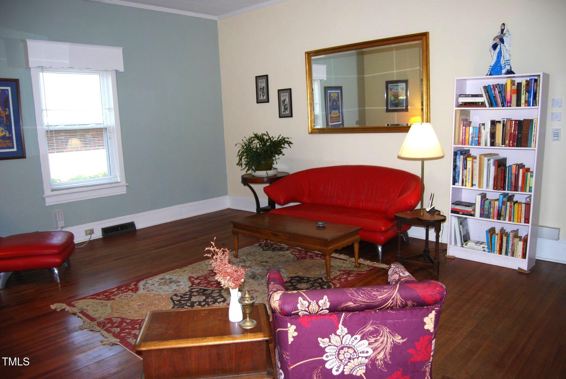 1013 Green Street Durham, NC 27701 - Photo 2 of 32 a living room with furniture and a book shelf