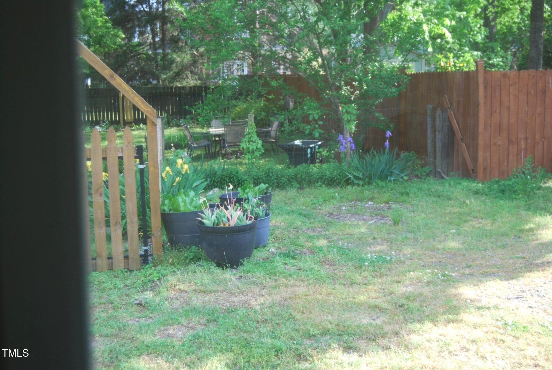 1013 Green Street Durham, NC 27701 - Photo 21 of 32 a view of a backyard with plants and a patio