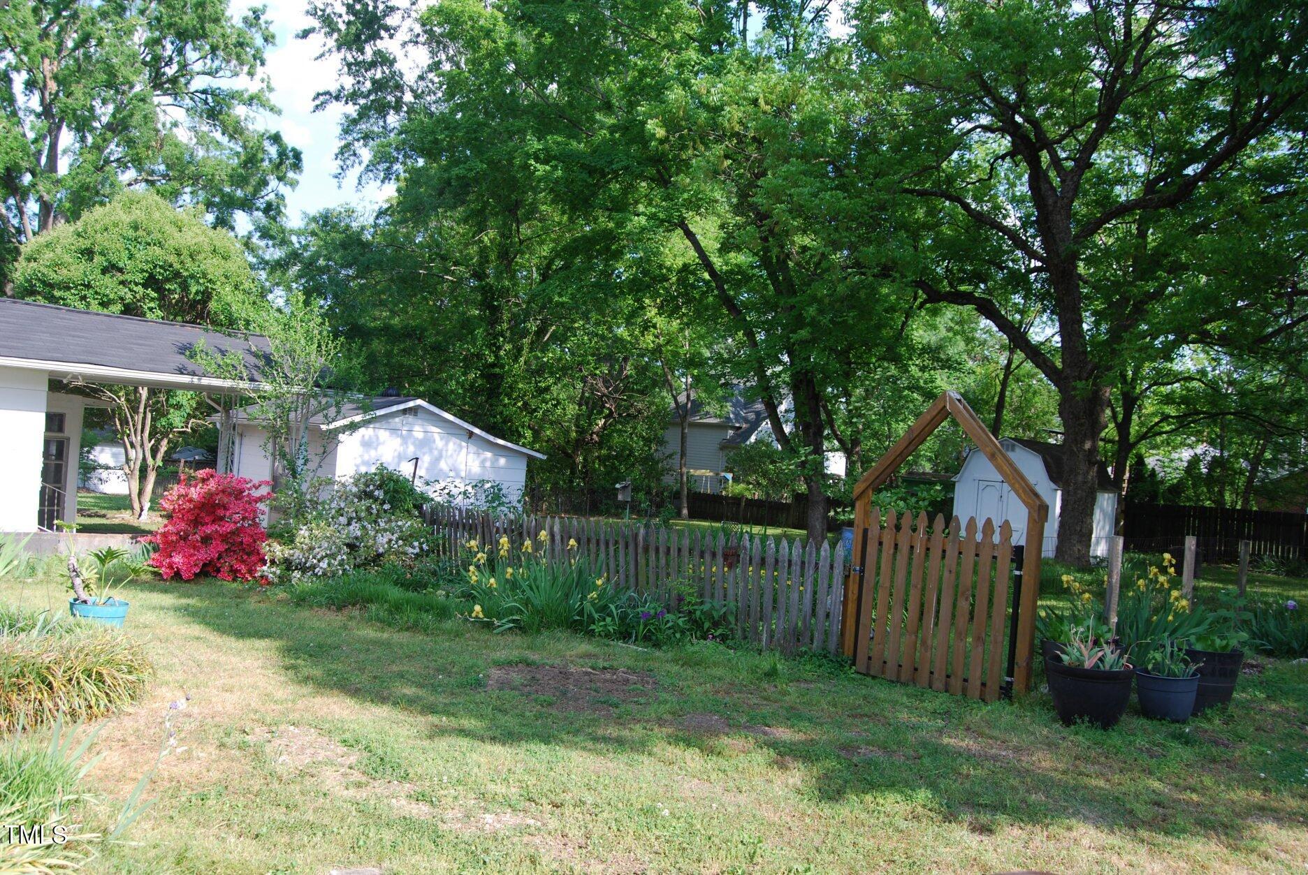 1013 Green Street Durham, NC 27701 - Photo 22 of 32 a view of a house with a yard and garden