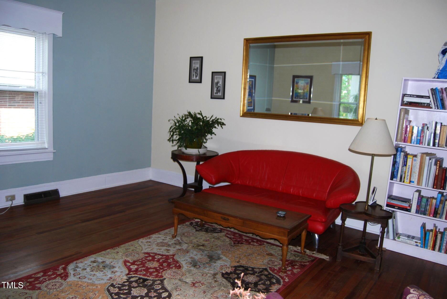 1013 Green Street Durham, NC 27701 - Photo 7 of 32 a living room with furniture and a book shelf