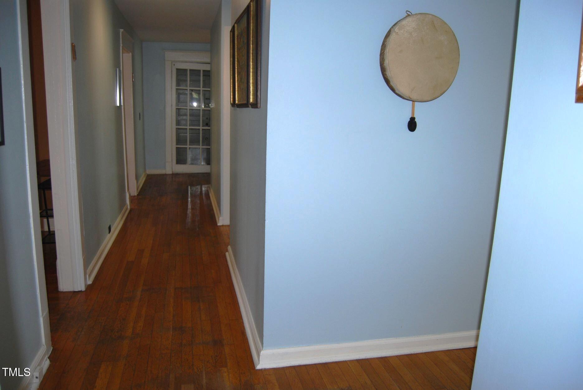 1013 Green Street Durham, NC 27701 - Photo 8 of 32 a view of a hallway with wooden floor