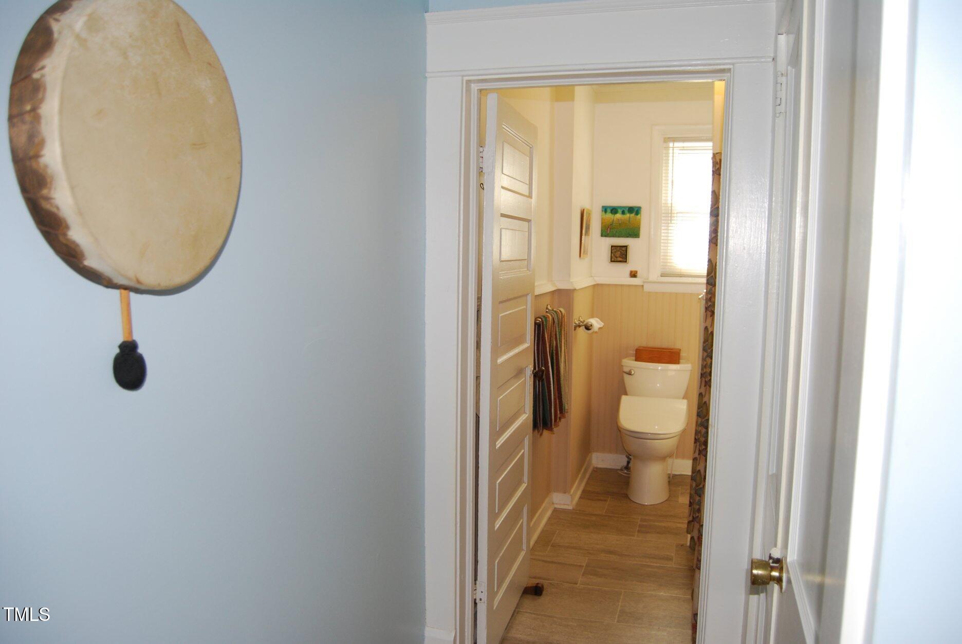 1013 Green Street Durham, NC 27701 - Photo 9 of 32 a bathroom with a toilet and a mirror