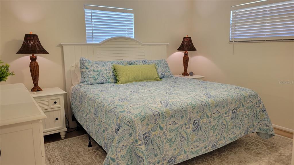 1526 Georgetowne Lane Sarasota, FL 34232 - Photo 12 of 21 a bedroom with a bed and a window