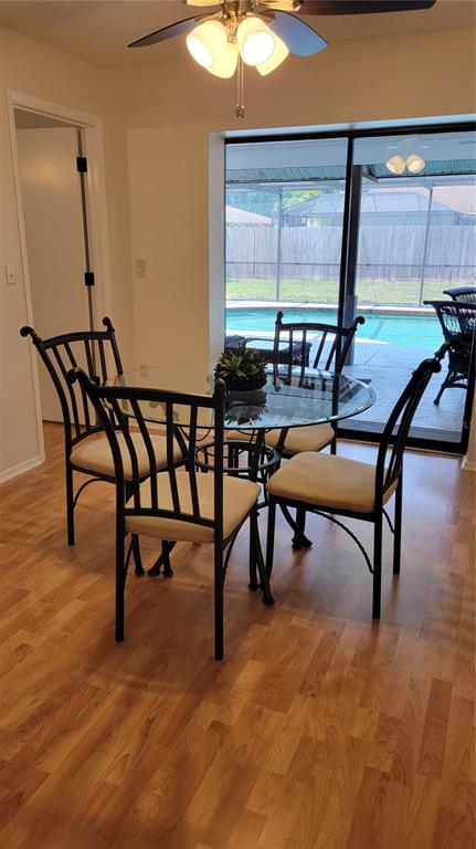 1526 Georgetowne Lane Sarasota, FL 34232 - Photo 7 of 21 a view of a room with furniture window and wooden floor