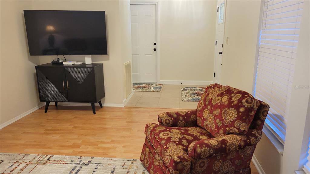 1526 Georgetowne Lane Sarasota, FL 34232 - Photo 9 of 21 a living room with furniture and a flat screen tv