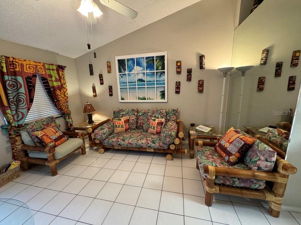 1865 Mazo Manor Road, Unit J2 Lutz, FL 33558 - Photo 7 of 12 a living room with furniture and a table