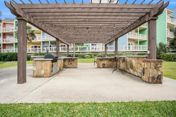 a patio area with table and chairs