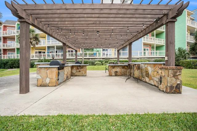 a patio area with table and chairs